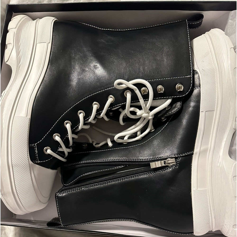 Trendy Black vegan leather high top sneakers.